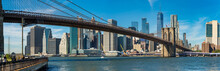 Iconic  View Of Brooklyn Bridge Over Manhatten Skyscrapers In New York.