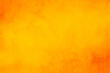Fototapeta  - Horizontal yellow and orange grunge texture cement or concrete wall banner, blank  background