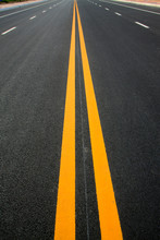 Double yellow lines on the asphalt road