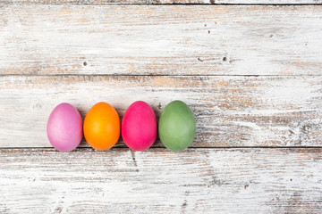 Easter eggs, frame, white wooden background, top view, copyspace