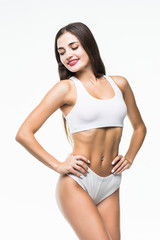 Wall Mural - Fitness woman with a beautiful body isolated on white background. healthcare concept.