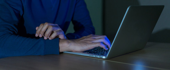 Wall Mural - close up on man hand typing or working on laptop for programming about cyber security , advance futu
