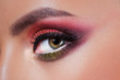 © Ulia Koltyrina - Amazing Bright eye makeup in luxurious scarlet shades. Pink and blue color, colored eyeshadow