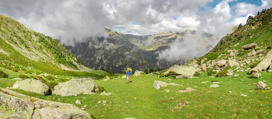 Wall Mural - hiker passing high range in the Pyrenees mountains
