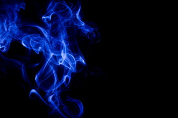 Blue smoke on black background