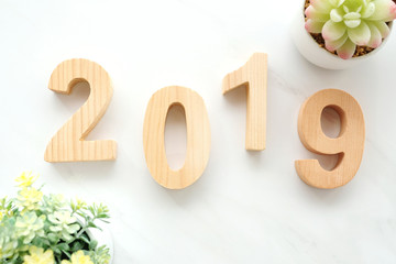 2019 happy new year wood letters on white marble background, 2019 new year greeting card banner