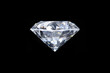 © Manutsawee - real loose brilliant round diamond side view on black background