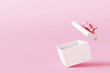 Open gift box on pastel pink background. 3d rendering