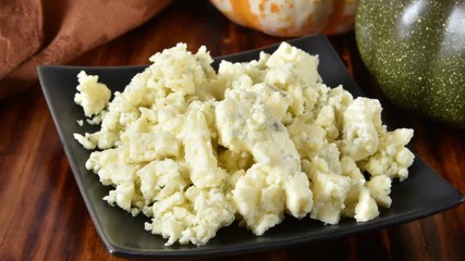 Wall Mural - Closeup of a dish of crumbled blue cheese