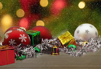 Wall Mural - Christmas composition with gift box with snow and decorations on  blurred bokeh light background