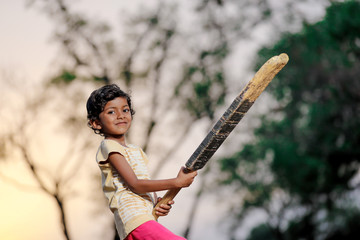 Wall Mural - indian girl child playing cricket