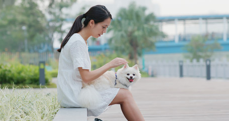 Canvas Print - Woman go out with her Pomeranian dog