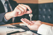 © joyfotoliakid - Sale agent giving Key house to customer and sign agreement contract, Insurance Home concept