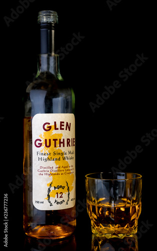 Download Open Bottle And Glass Of Highland Whisky On A Black Glass Table Background Is Black Whisky Is 12 Years Old Room For Text Fake Label To Avoid Copyright Buy This Stock PSD Mockup Templates