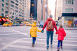 © travnikovstudio - Family of father and little kids on Times Square during their vacation in New York City