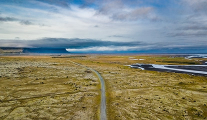 Sticker - Aerial view of an Icelandic landscape with a road in the middle