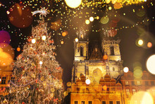 Decorated Christmas Tree Stands On The Main Square In Prague During The New Year Holidays.