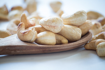 roasted cashew nuts on a white background