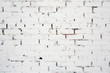 Texture white cracked brick wall.