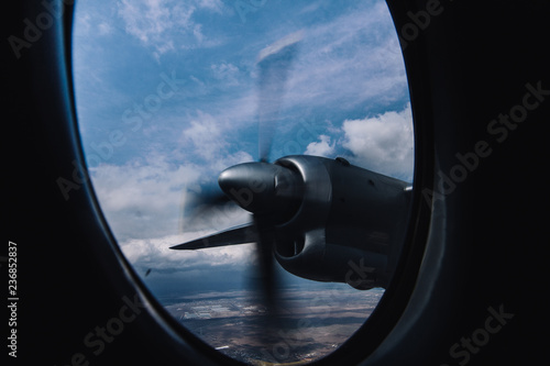 Fotografie, Obraz Turboprop engine view from illuminator with aerial bright background