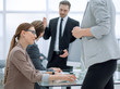 © ASDF - employees of the company work in the office