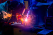 © Grispb - Welding work. A man in a protective mask. Welder. Welding work in production. Sparks from welding. A man welds metal products.