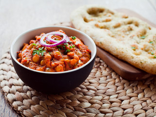 Wall Mural - Chickpea Vegetarian Curry  -  Chana Masala with Naan Bread.