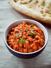 Wall Mural - Chickpea Vegetarian Curry  -  Chana Masala with Naan Bread.