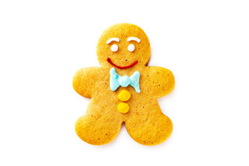 Wall Mural - Smiling single gingerbread man christmas cookie isolated at white background.