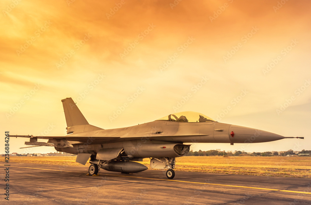 Fighting military fighter jet aircraft parked on runway in the base ...