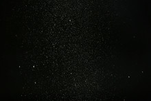 Snow Flakes Falling On Black Background. Winter Weather