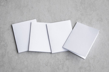 Blank portrait mock-up paper. brochure magazine isolated on gray, changeable background / white paper isolated on gray