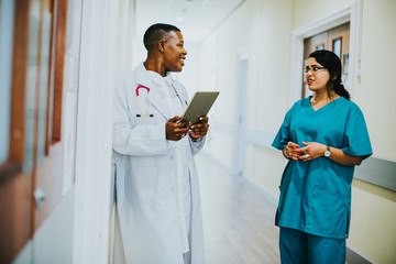 Medical professionals having a conversation in the hallway