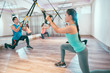 © PR Image Factory - young people are training indoors with TRX