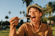 © Rawpixel.com - Man eating sushi in the park
