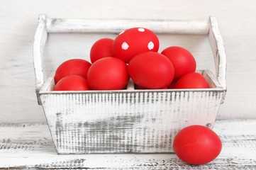 Wall Mural - Red Easter eggs in wooden box