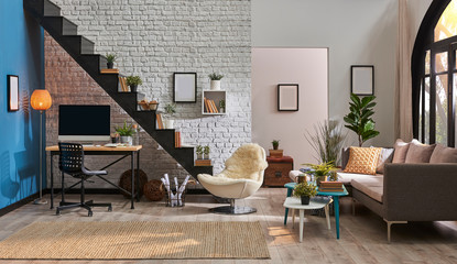 Home decoration, modern home, black stairs detail, wooden desk and desktop, frame lamp carpet and furniture in the living room. Black windows and garden view.