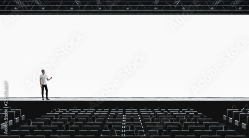 Download Presentation Hall With Person On Scene Auditorium Blank Screen Mockup Stock Photo Adobe Stock