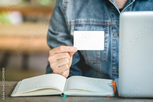 Women S Jean Jecket Is Hand Holding White Business Card For