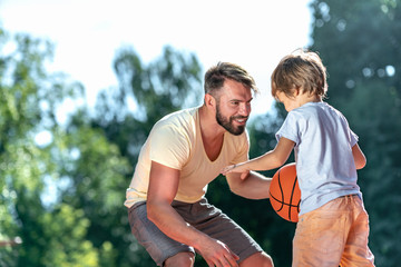 Wall Mural - Dad and son playing basketball