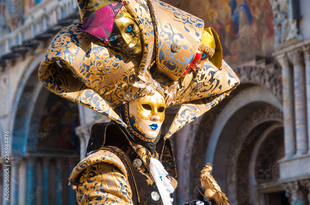 Person wearing venitian carnival mask during Venice carnival in Italy - obrazy, fototapety, plakaty 