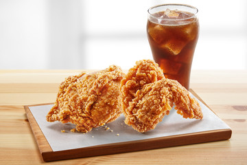 Wall Mural - crispy coated batter southern style fried chicken in a wooden table