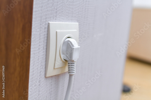 White Power Cord Cable Plugged In Wall Socket Buy This