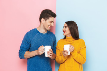 Poster - Beautiful young couple standing isolated