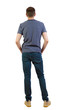 © ghoststone - Back view of man in dark jeans. Standing young guy.