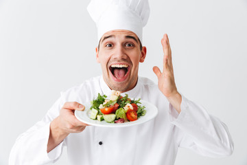 Wall Mural - Excited man chef cook wearing uniform