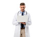 © LIGHTFIELD STUDIOS - focused doctor in white coat using laptop isolated on white