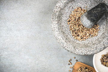 Wall Mural - White peppercorn seed in granite mortar or pestle