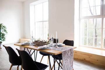 Table setting with holiday decorations. Preparation for christmas dinner