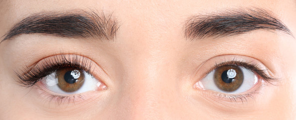 Sticker - Closeup view of beautiful young woman before and after eyelash extension procedure